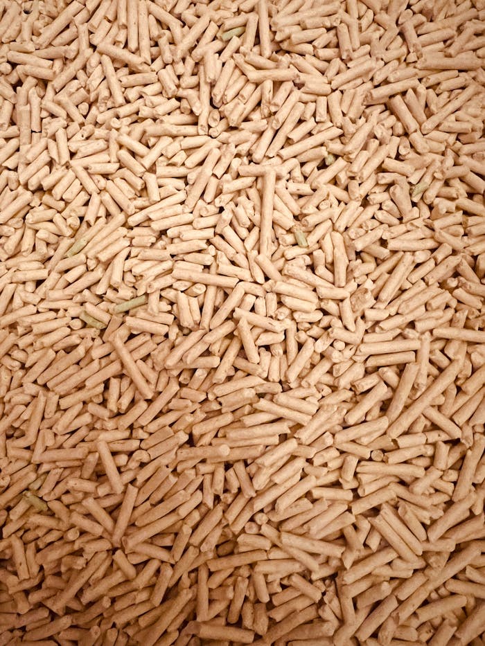 about-05 A detailed top view of a large pile of wood pellets used for renewable fuel and energy.